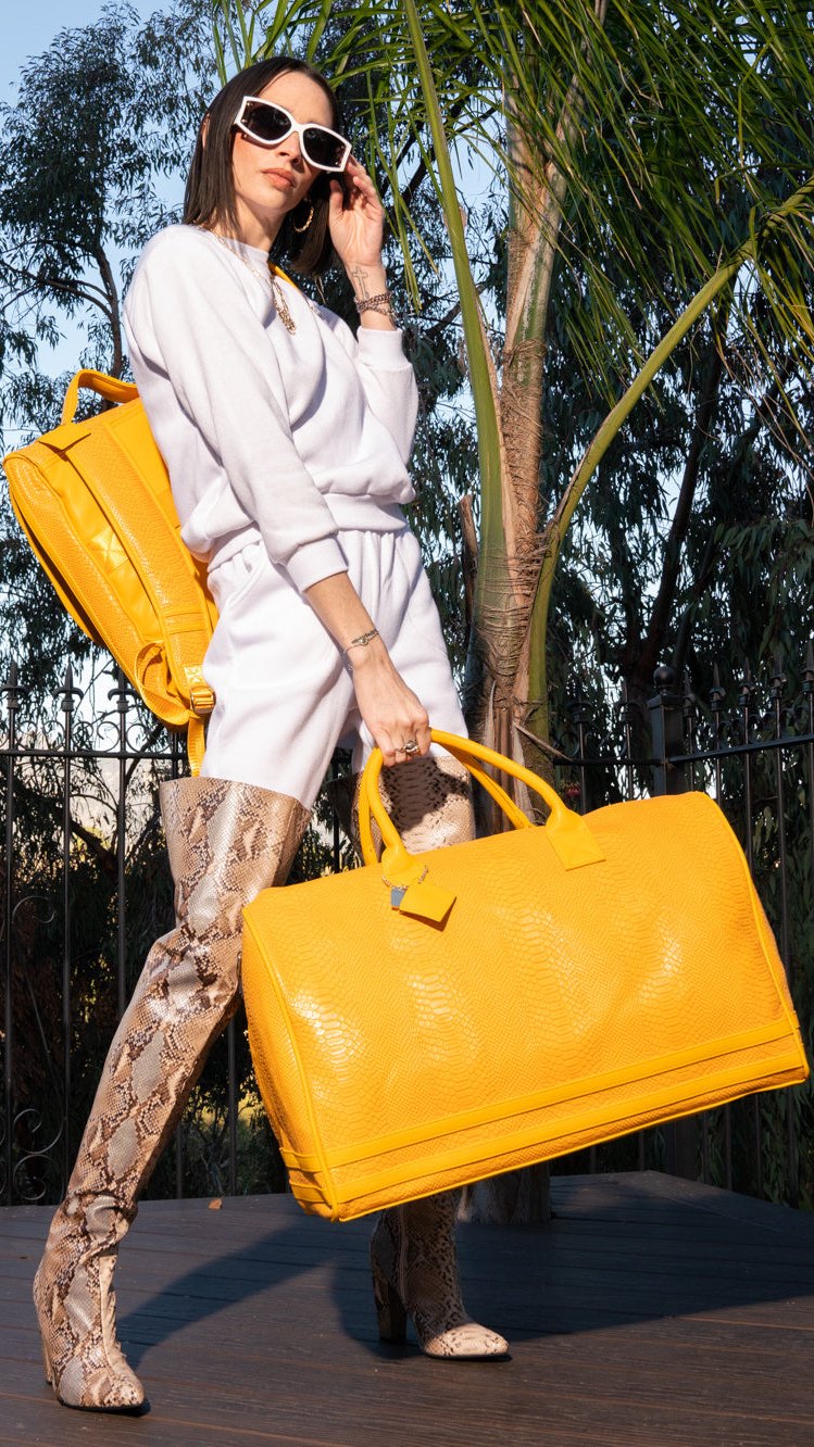 Backpack on, duffle in hand