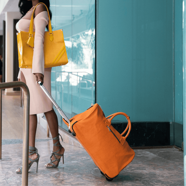 Signature Traveler Rolling Duffle in Tangerine
