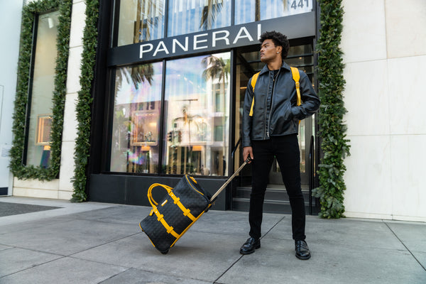 Bodega Traveler Rolling Duffle in Black & Mustard
