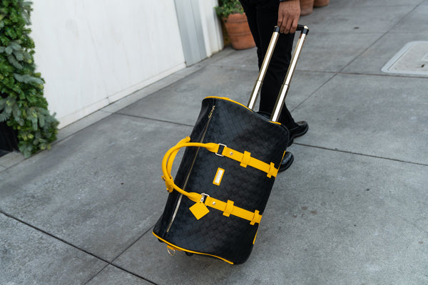 Bodega Traveler Rolling Duffle in Black & Mustard