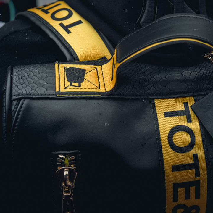 Caution Tape Backpack in Black & Yellow