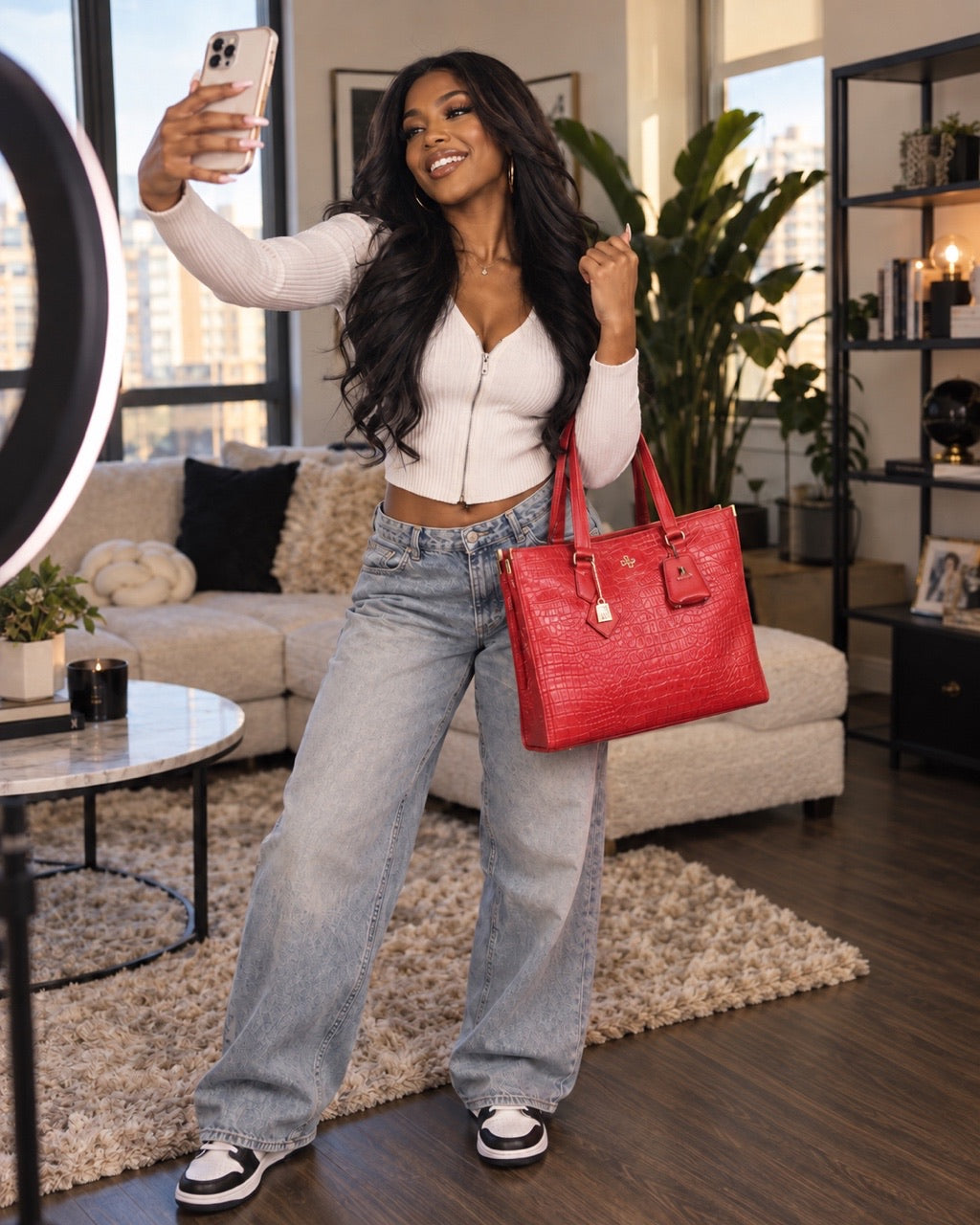 Creator filming herself with her Tote&Carry bags